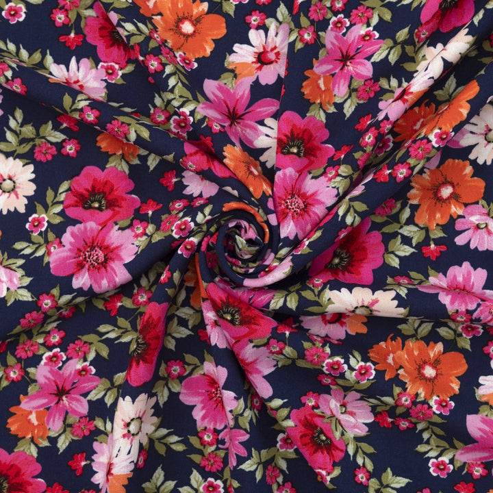 Rayon Challis Navy Floral Oasis medium-weight fabric with vibrant pink and blue florals on navy base