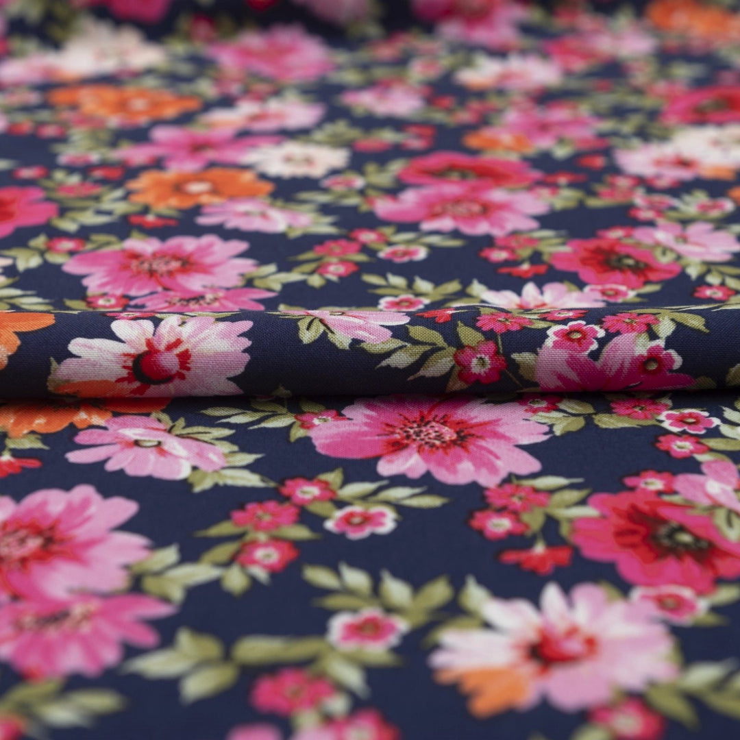 Rayon Challis Navy Floral Oasis medium-weight fabric with vibrant pink and blue florals on navy base