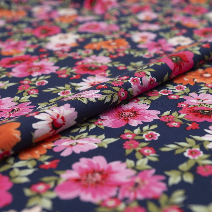 Rayon Challis Navy Floral Oasis medium-weight fabric with vibrant pink and blue florals on navy base
