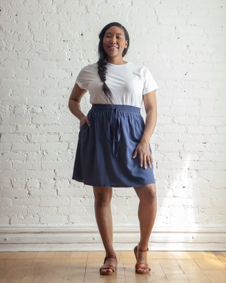 True Bias Mave Skirt sewing pattern in drapey fabric, featuring elastic waistband, inseam pockets, and optional ruffle hem in multiple lengths.