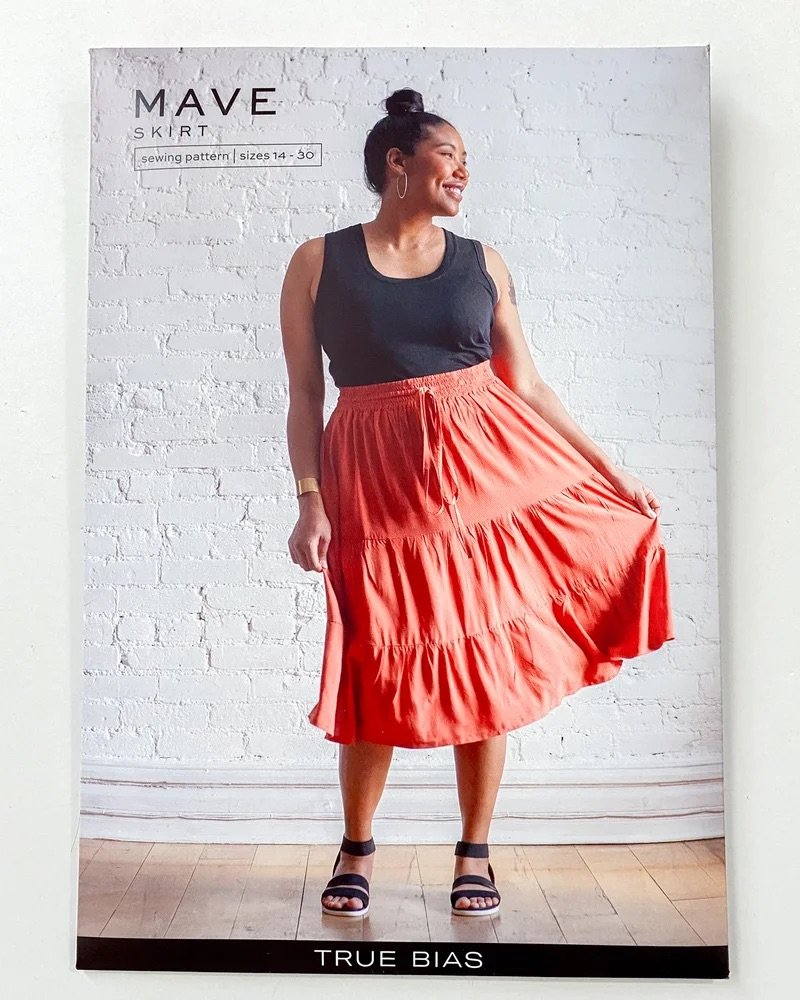 True Bias Mave Skirt sewing pattern in drapey fabric, featuring elastic waistband, inseam pockets, and optional ruffle hem in multiple lengths.