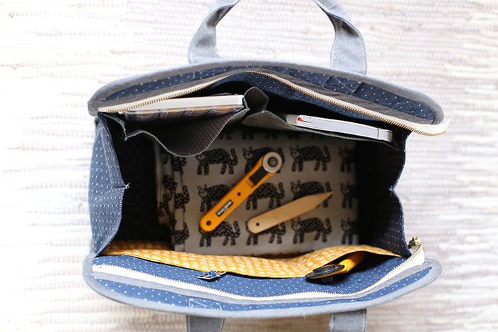 Noodlehead Maker’s Tote sewing pattern for DIY craft organizer bag with zippered pockets and two sizes