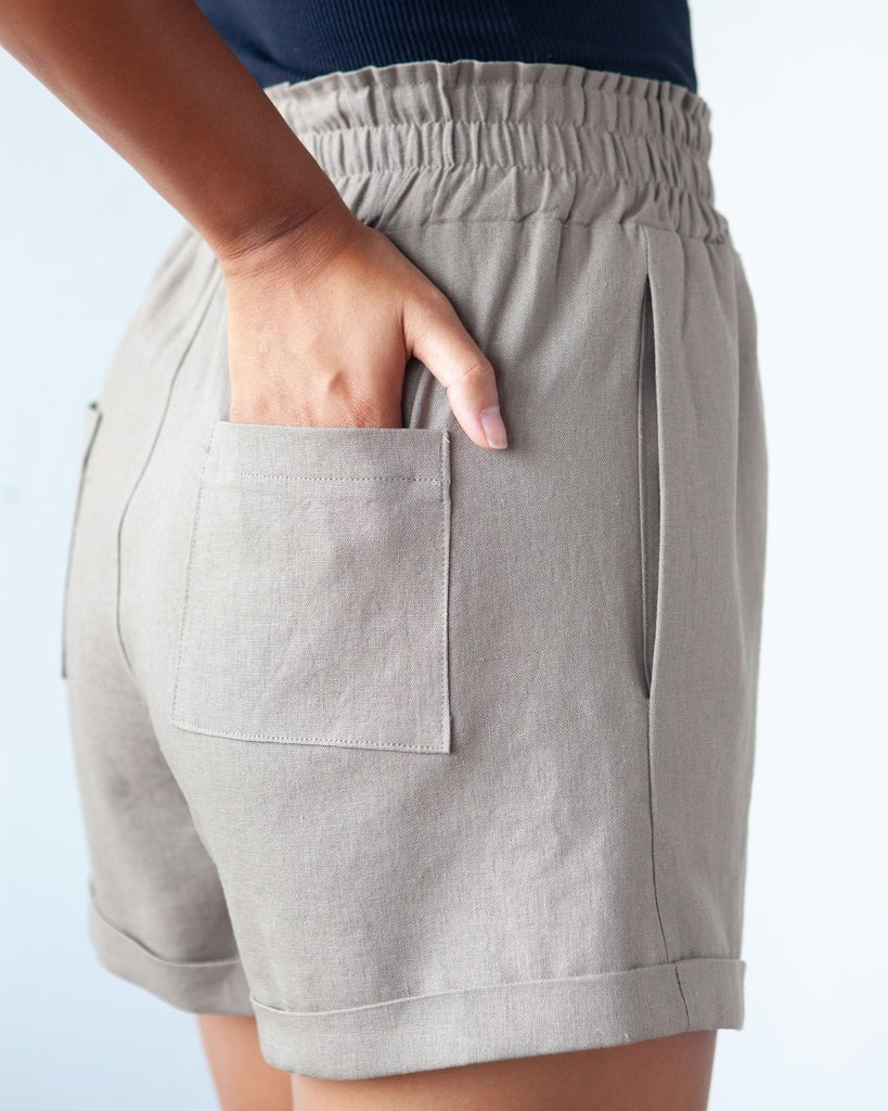 True Bias Dani Short & Pant sewing pattern with shorts and ankle-length pant variations, paperbag waist, pockets, and cuffed hem in sizes 0–18.