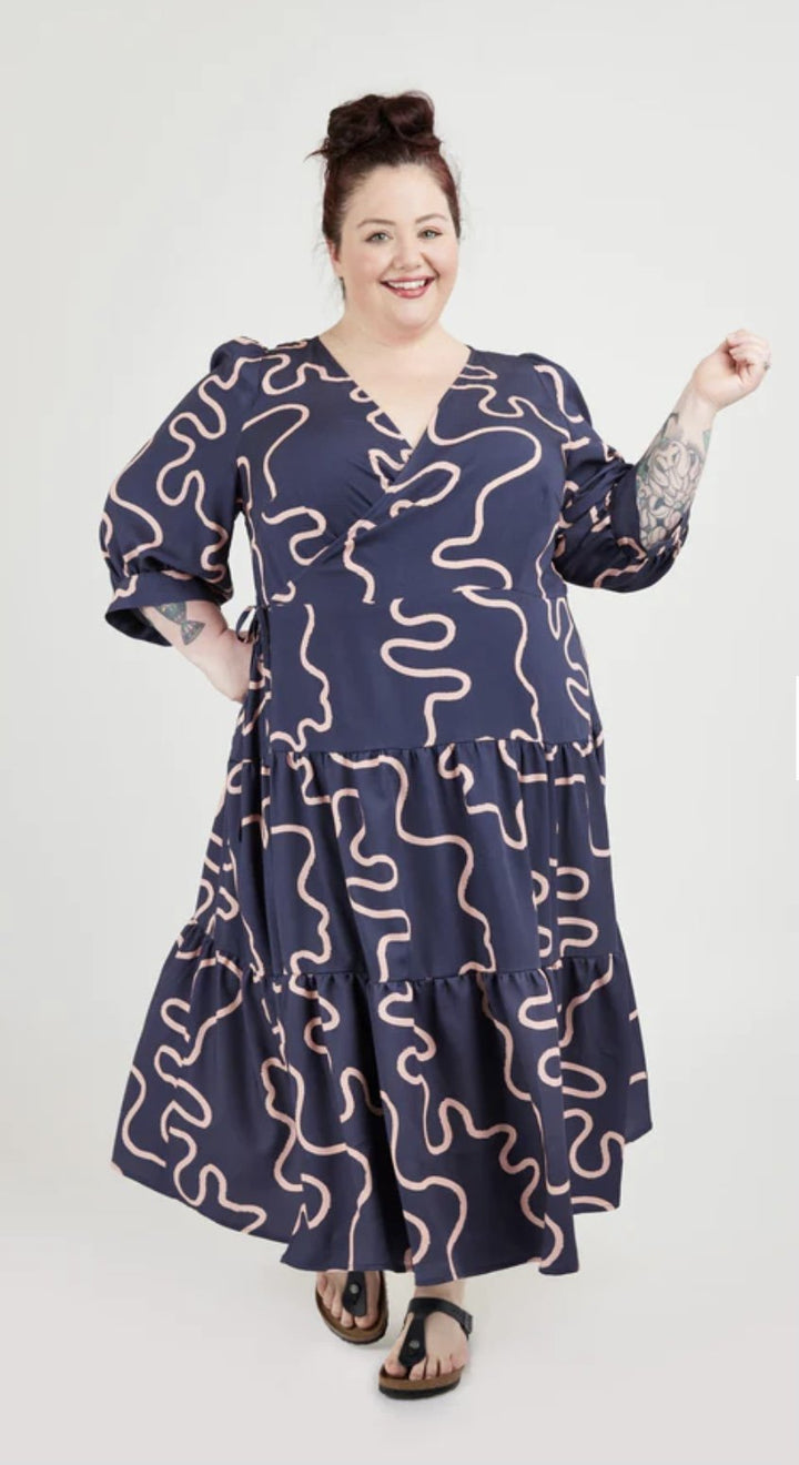 Cashmerette Roseclair Dress sewing pattern with wrap design, three sleeve and skirt variations, and curve-friendly fit in sizes 0–32.