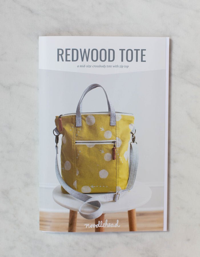 Noodlehead Redwood Tote sewing pattern for DIY crossbody bag with zippered pockets and adjustable strap