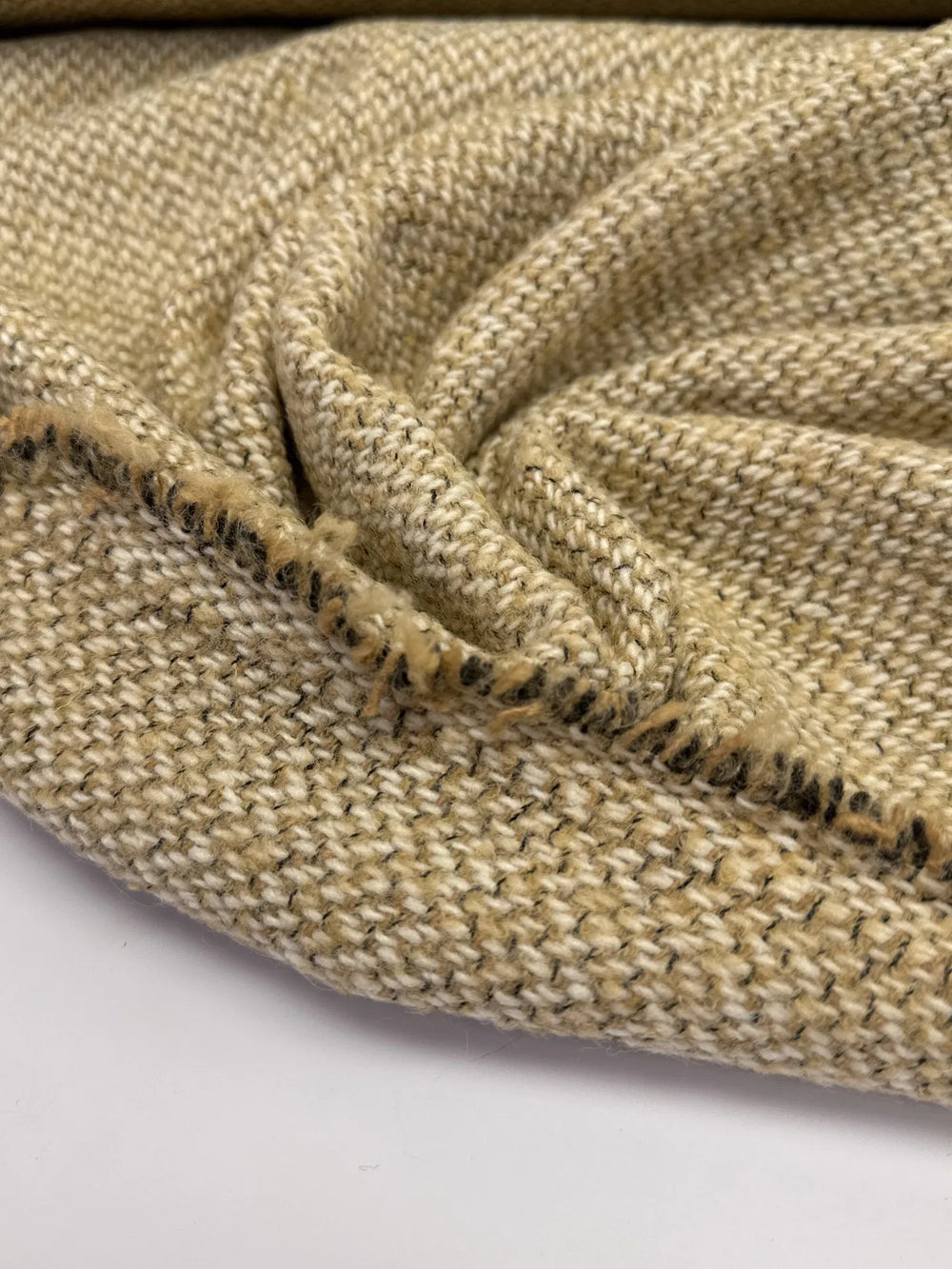 Elegant Italian cream and beige Tweed Twill Weave, a wool-silk blend ideal for suiting, coats, skirts, and dresses with timeless durability.