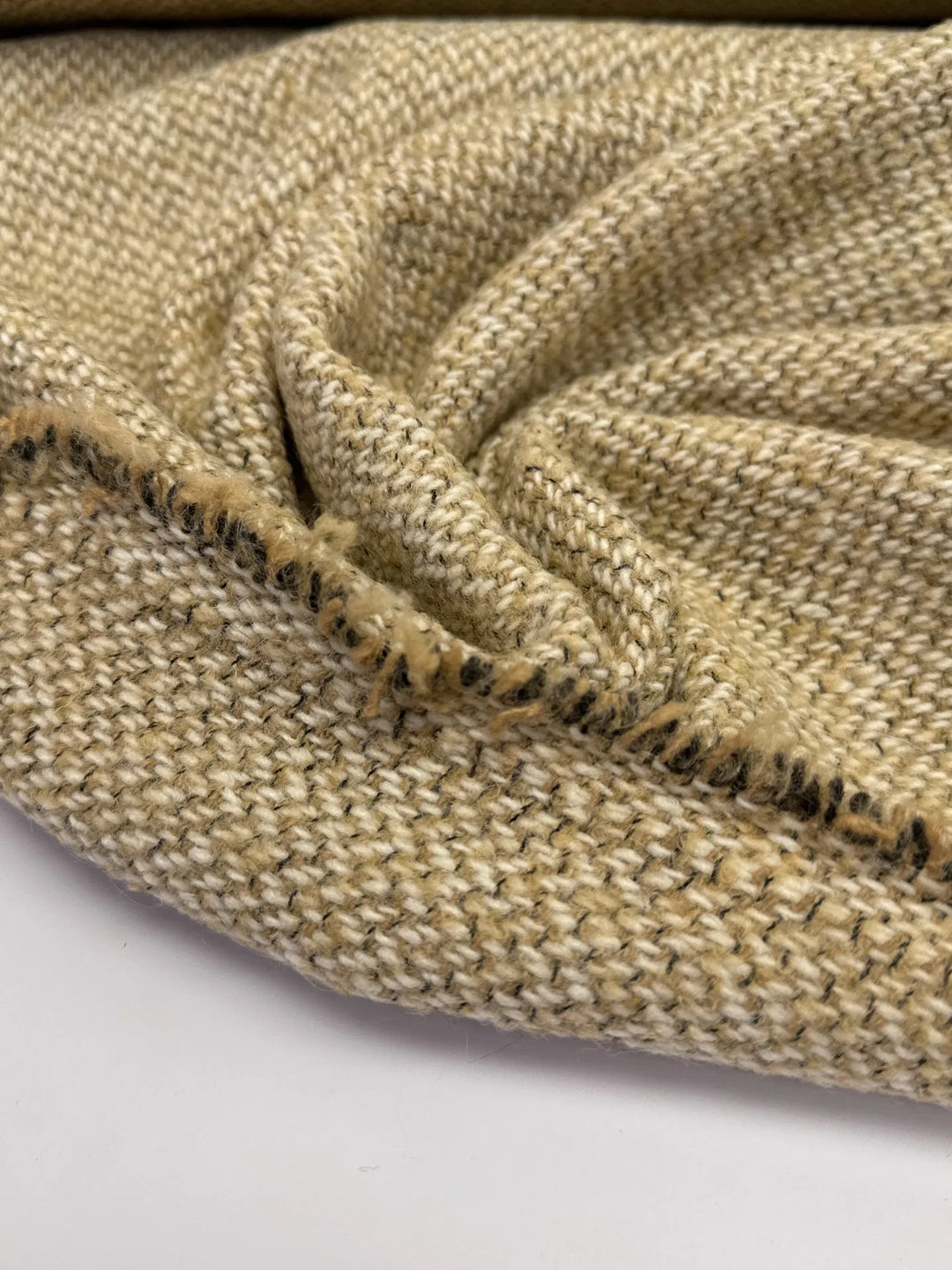 Elegant Italian cream and beige Tweed Twill Weave, a wool-silk blend ideal for suiting, coats, skirts, and dresses with timeless durability.