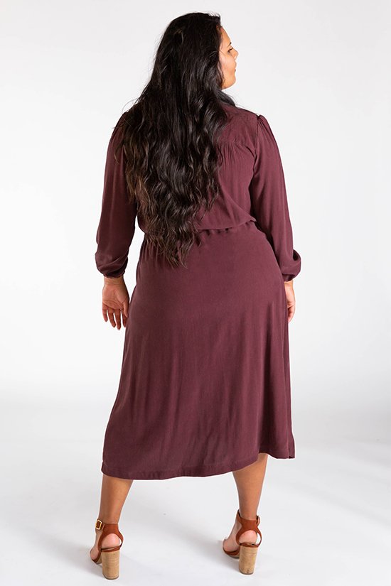 Chalk & Notch Orchid Midi Dress sewing pattern featuring wrap bodice, flowing midi skirt, and sleeve options with ruffle or long gathered sleeves.