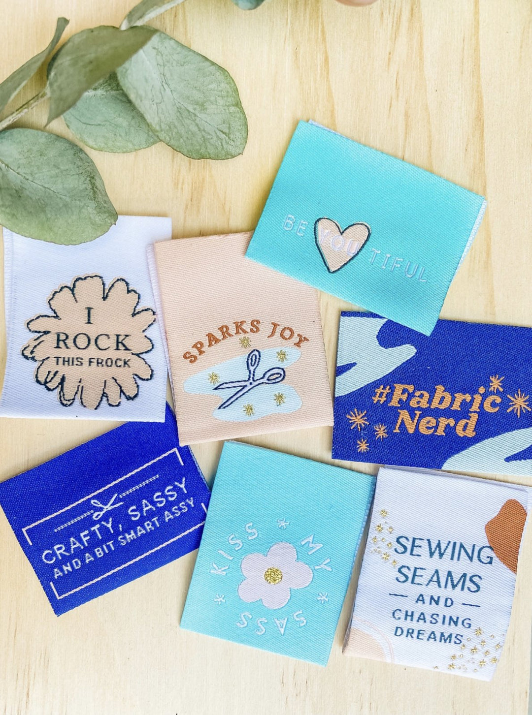 Fun woven sew-in labels for handmade garments - pack of 7 quirky slogans like 'Kiss My Sass' and 'Fabric Nerd