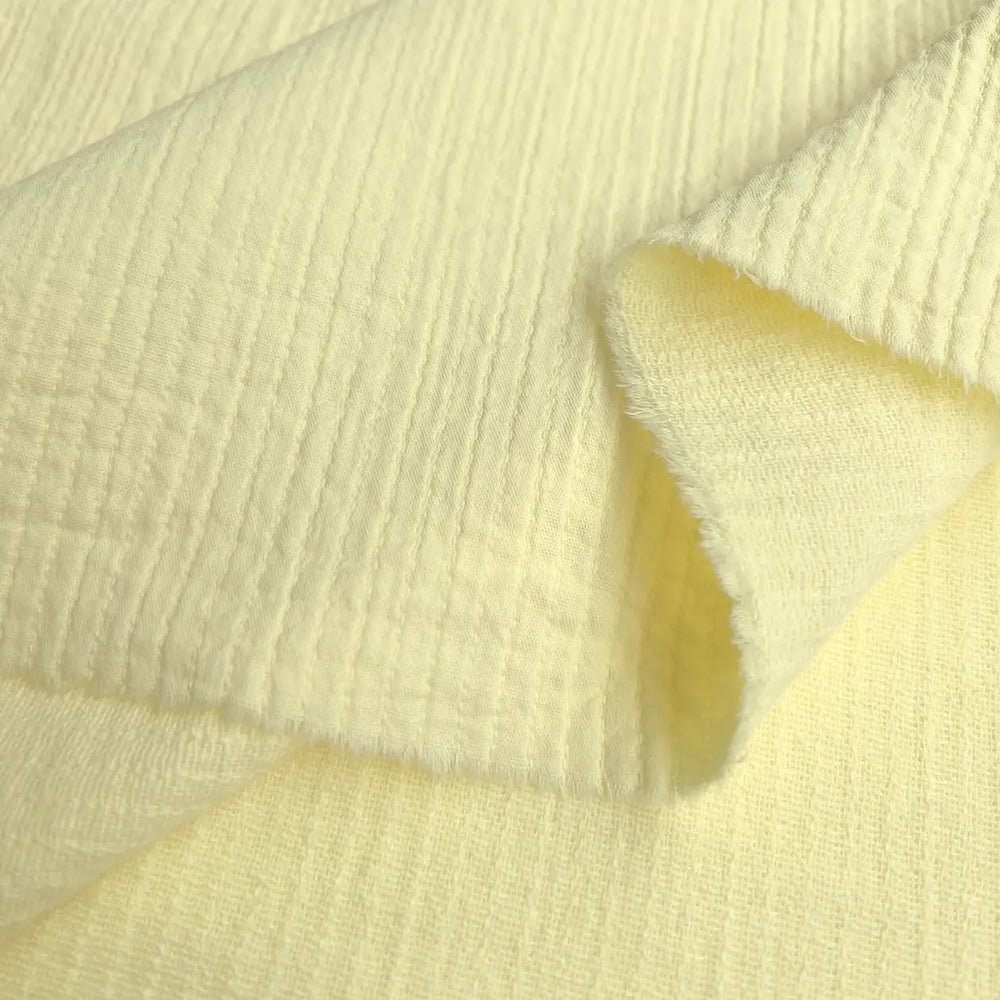 Cotton Double Layered Woven Stripes fabric in vibrant lemon yellow, perfect for shirts and loungewear.