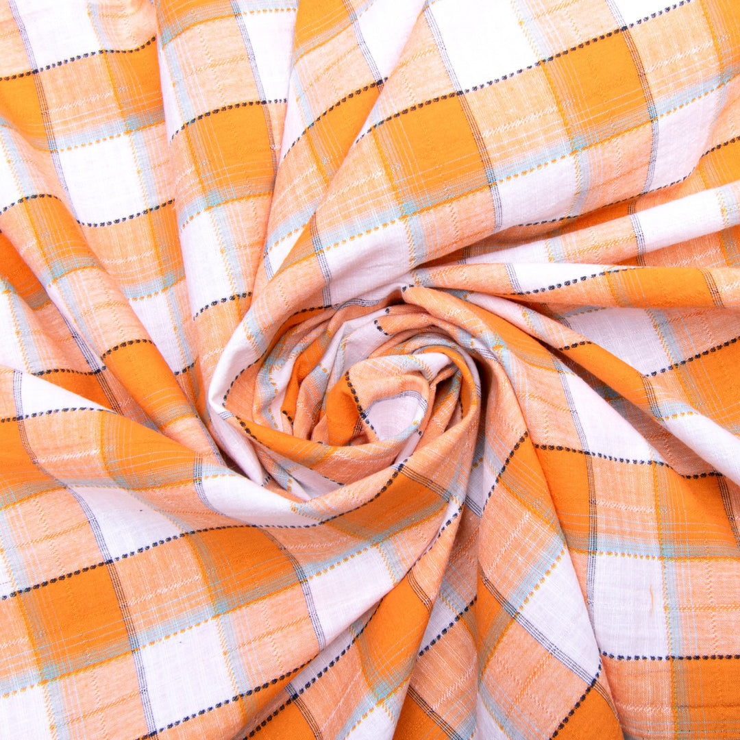 Orange and white plaid cotton shirting fabric close-up texture