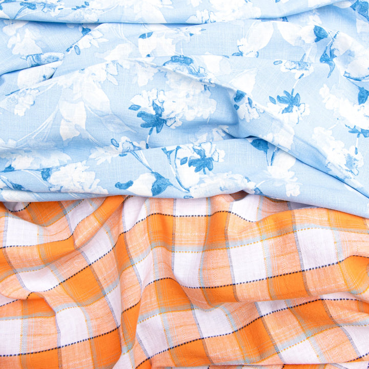 Orange and white plaid cotton shirting fabric close-up texture