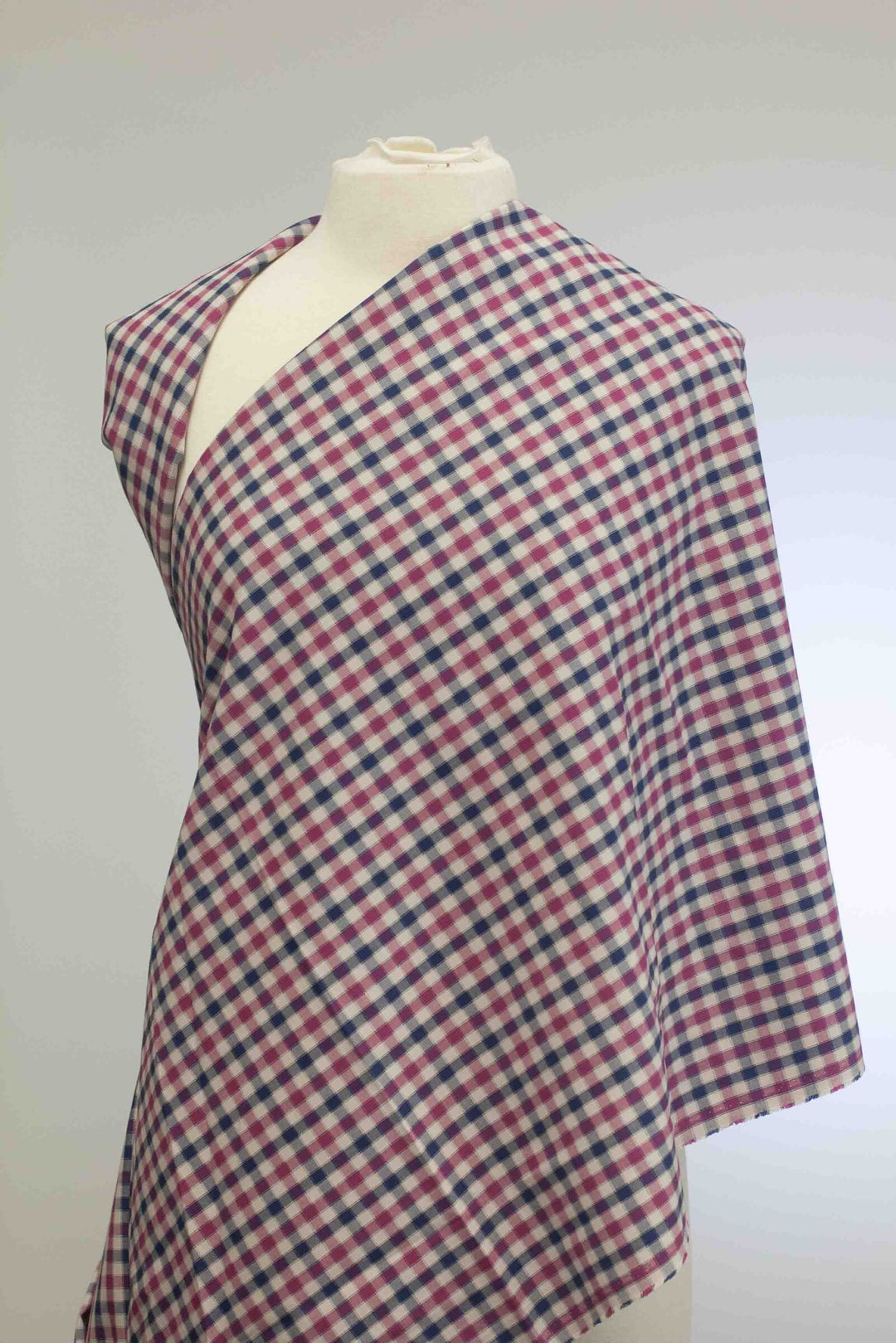 Lightweight Tattersall check cotton twill fabric in blue, pink, and cream
