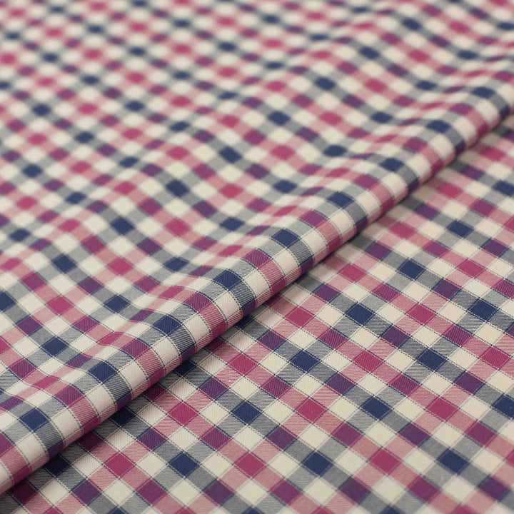 Lightweight Tattersall check cotton twill fabric in blue, pink, and cream