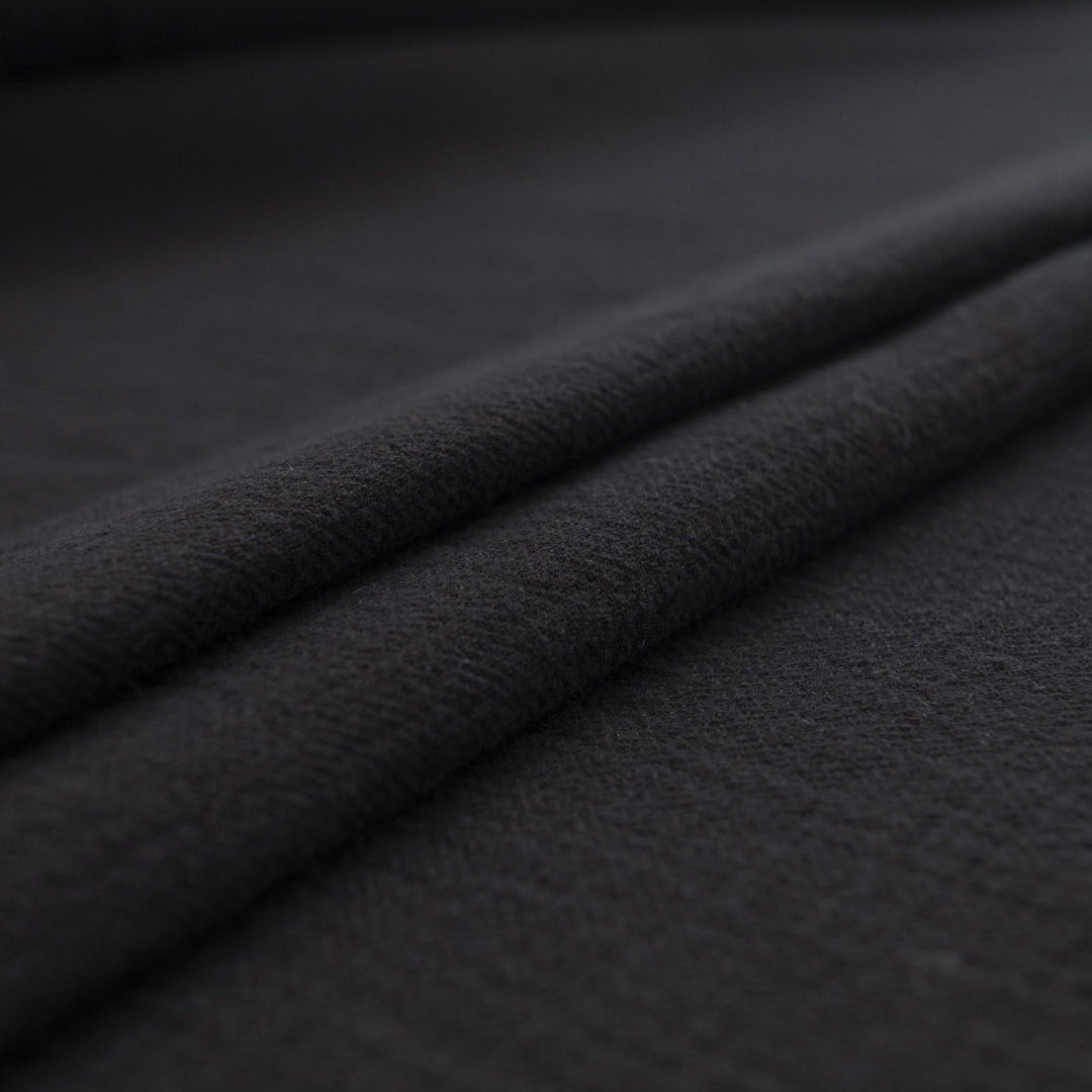 Crinkle Cotton Black 100% cotton fabric with textured finish for sewing pants, skirts, and dresses