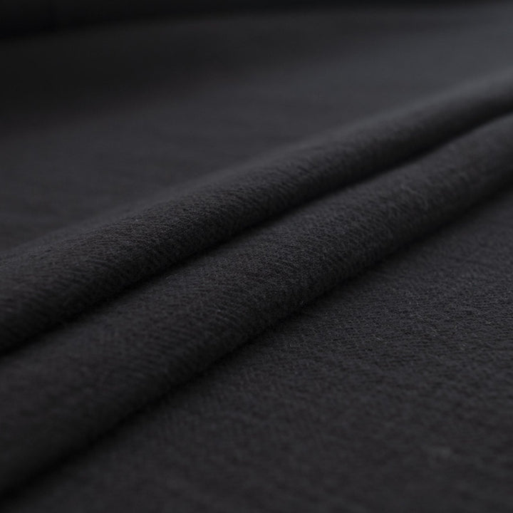 Crinkle Cotton Black 100% cotton fabric with textured finish for sewing pants, skirts, and dresses
