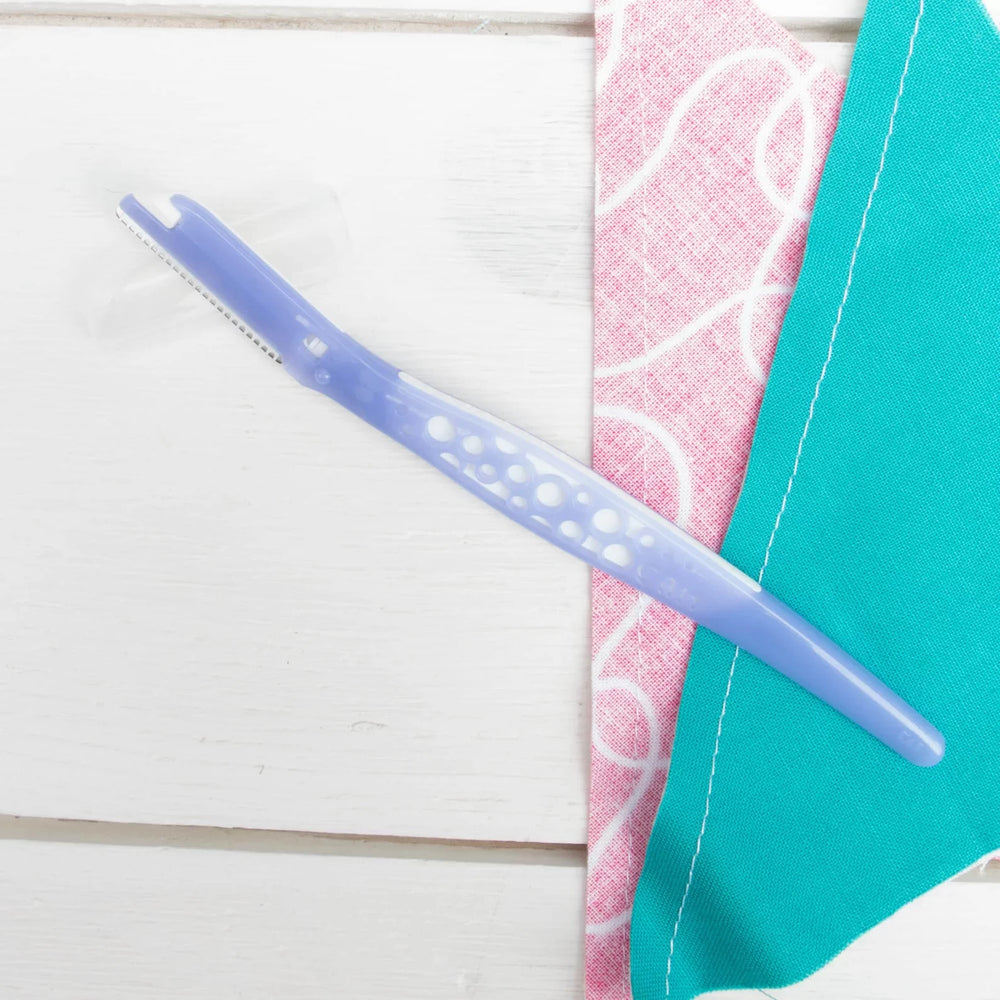Kai Seam Remover sewing tool with safety guard for removing stitches and threads