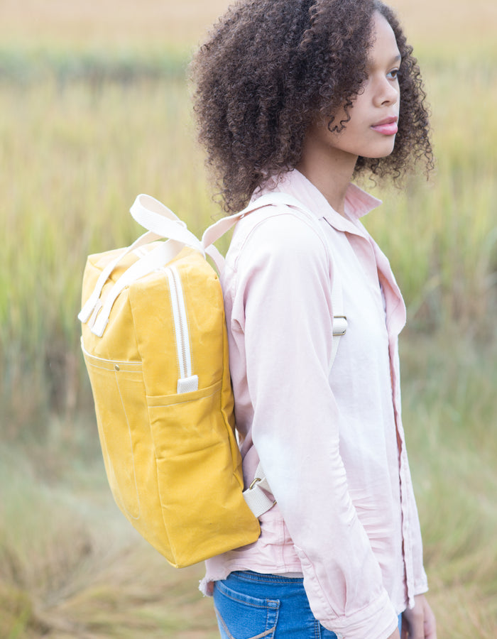 Noodlehead Making Backpack pattern in regular and mini sizes with customizable fabrics and pockets