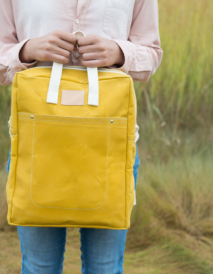 Noodlehead Making Backpack pattern in regular and mini sizes with customizable fabrics and pockets