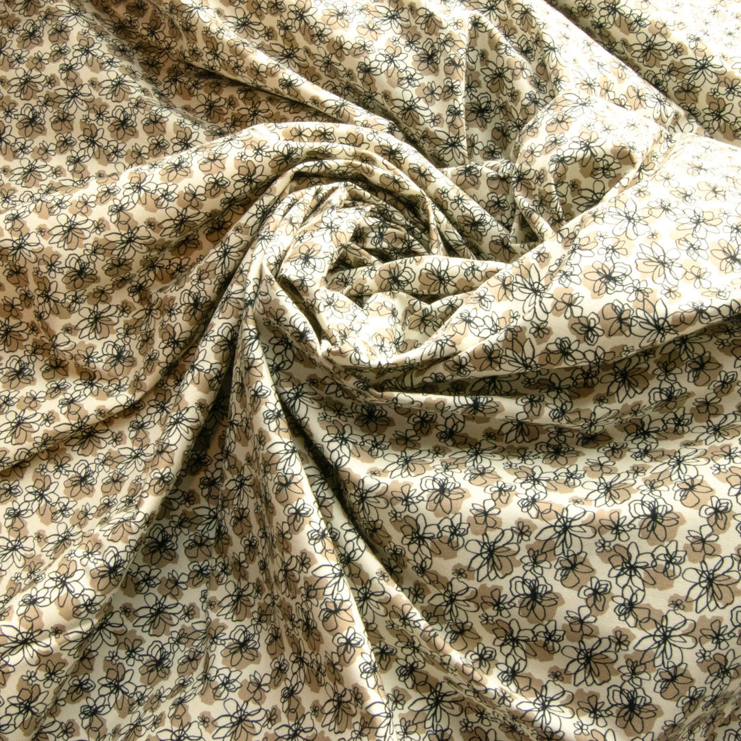 French cotton poplin fabric with black and tan daisy print, 57-inch wide deadstock textile