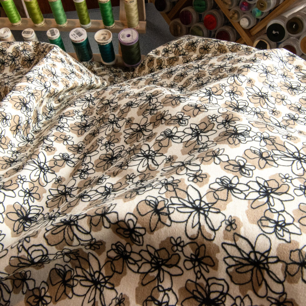 French cotton poplin fabric with black and tan daisy print, 57-inch wide deadstock textile