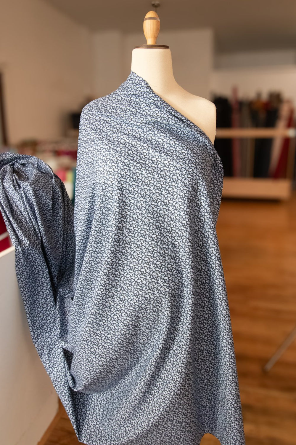 French cotton poplin fabric with 3% elastane shown on bolt, extra-wide 62" deadstock shirting material