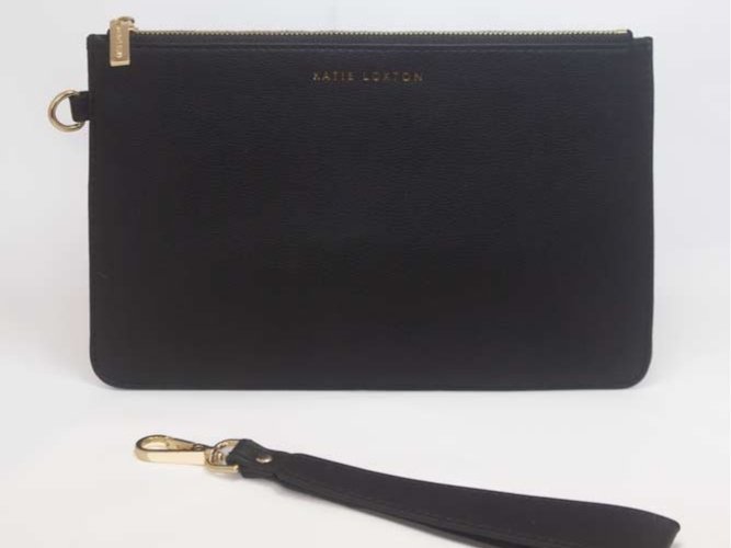 Everyday wristlet clutch in neutral color with removable strap and minimalist design.