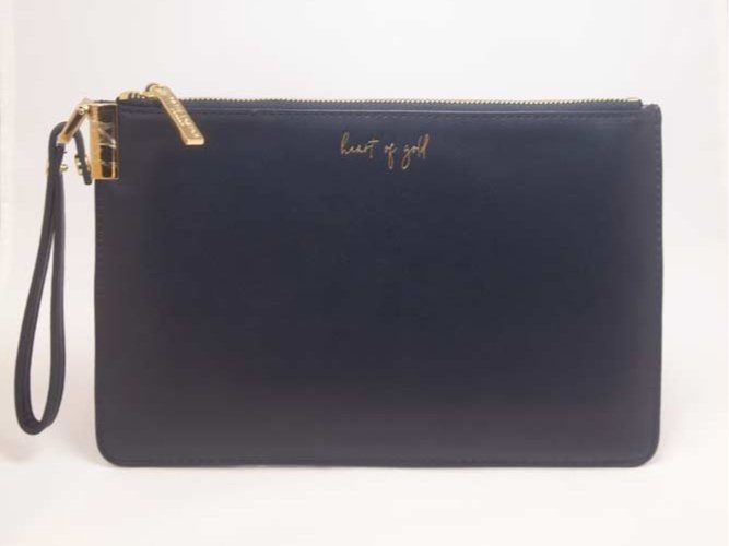 Everyday wristlet clutch in neutral color with removable strap and minimalist design.