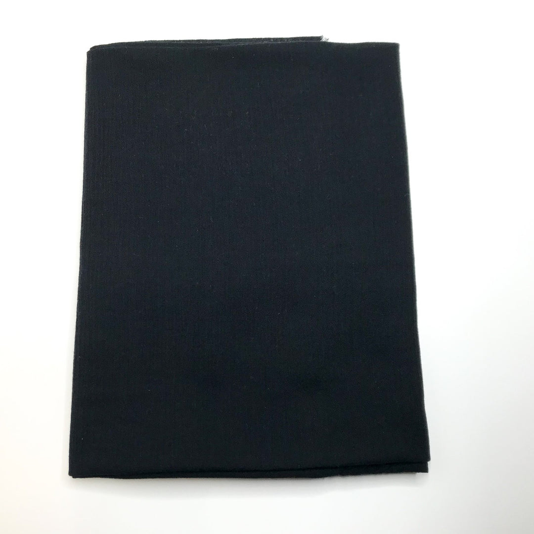 Folded black cotton gauze fabric remnant, 100% cotton, 1 yard 9 inches long and 47/48 inches wide, displayed on a white background.