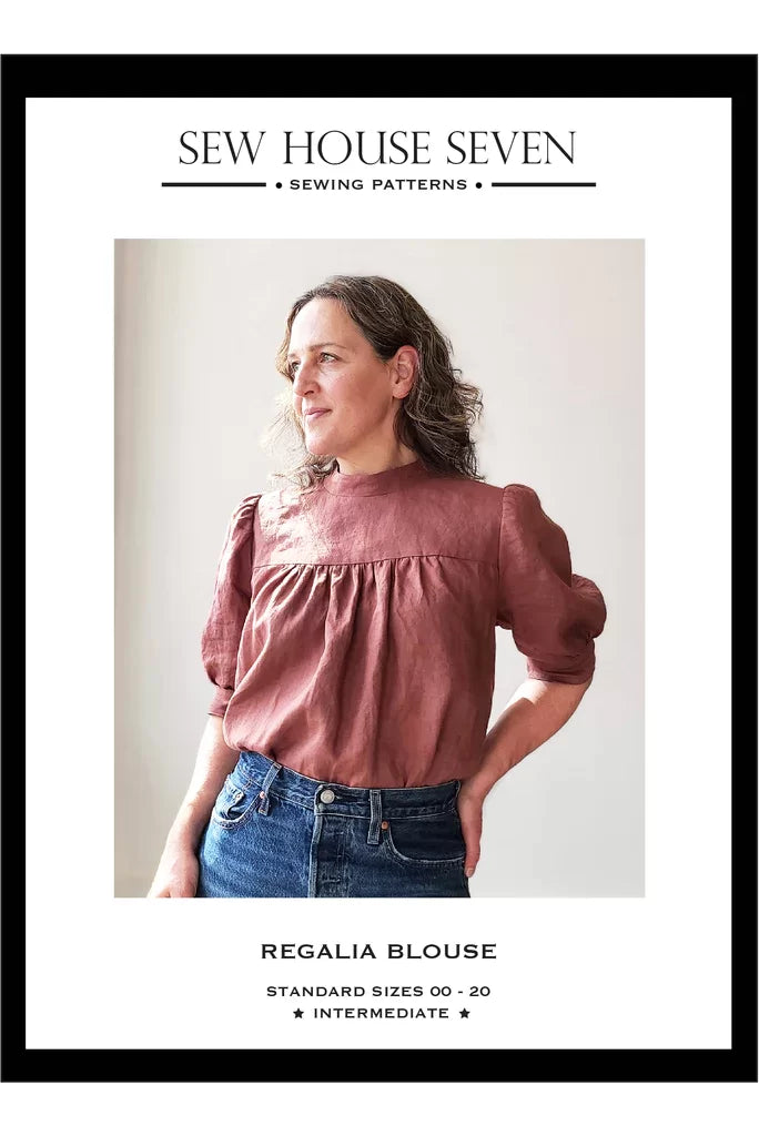 Sew House Seven Regalia Blouse sewing pattern with gathered sleeves, stand-up collar, and tie-back design – standard sizes 00–20