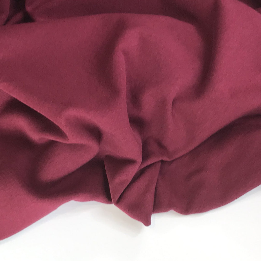 Burgundy Sweatshirt Fleece fabric with soft texture and rich color, ideal for cozy and stylish garments

