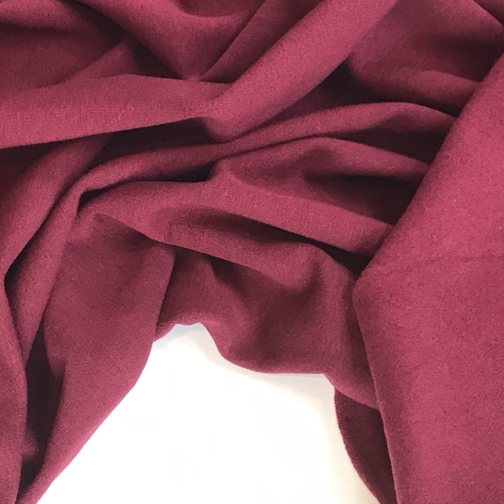 Burgundy Sweatshirt Fleece fabric with soft texture and rich color, ideal for cozy and stylish garments

