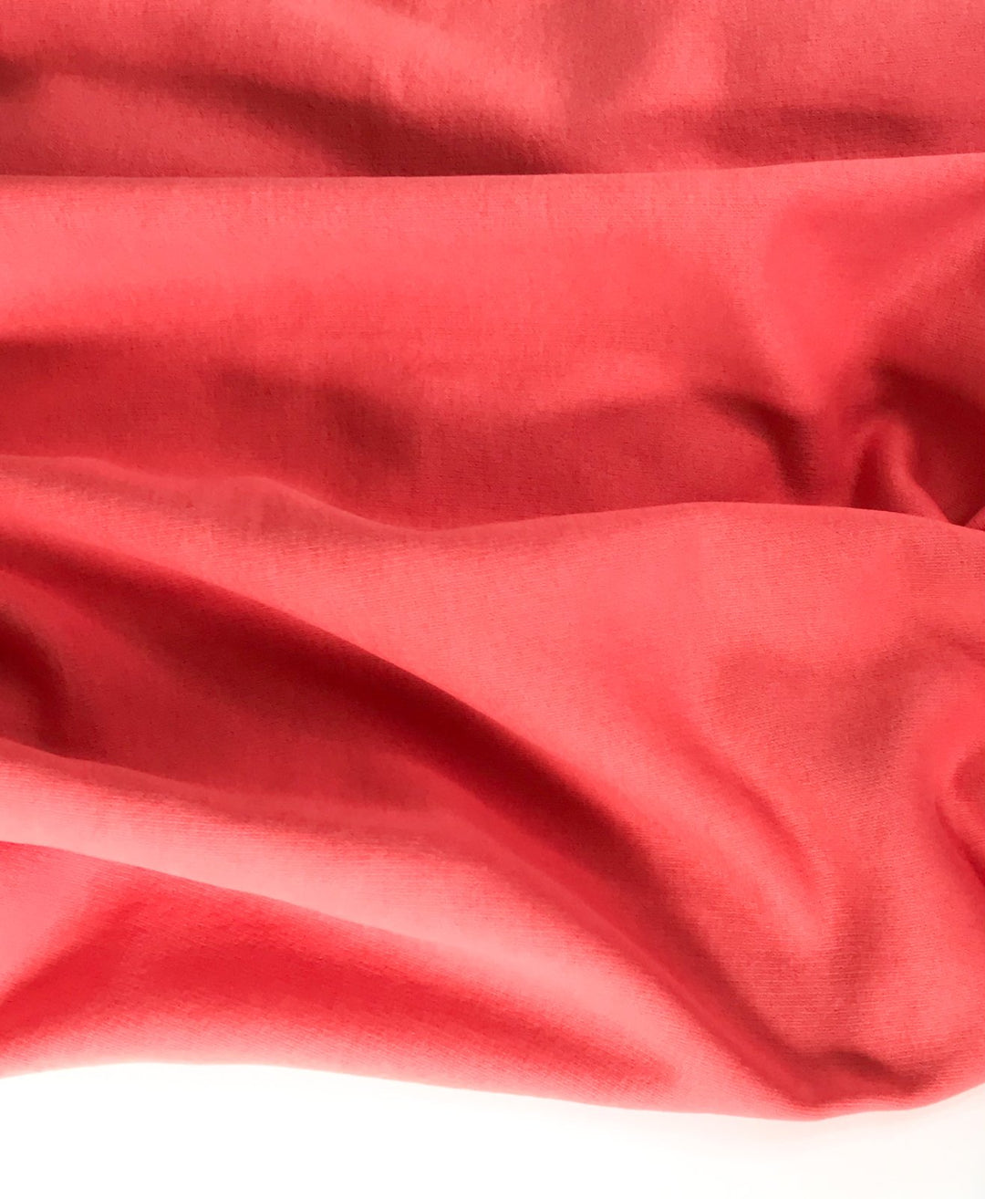 Coral Sweatshirt Brushed Fleece fabric with soft brushed texture and fluffy back, ideal for cozy apparel

