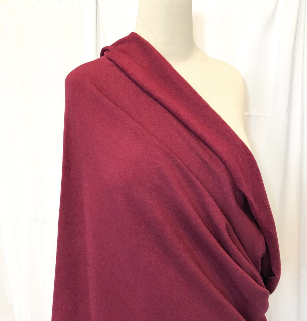 Burgundy Sweatshirt Fleece fabric with soft texture and rich color, ideal for cozy and stylish garments


