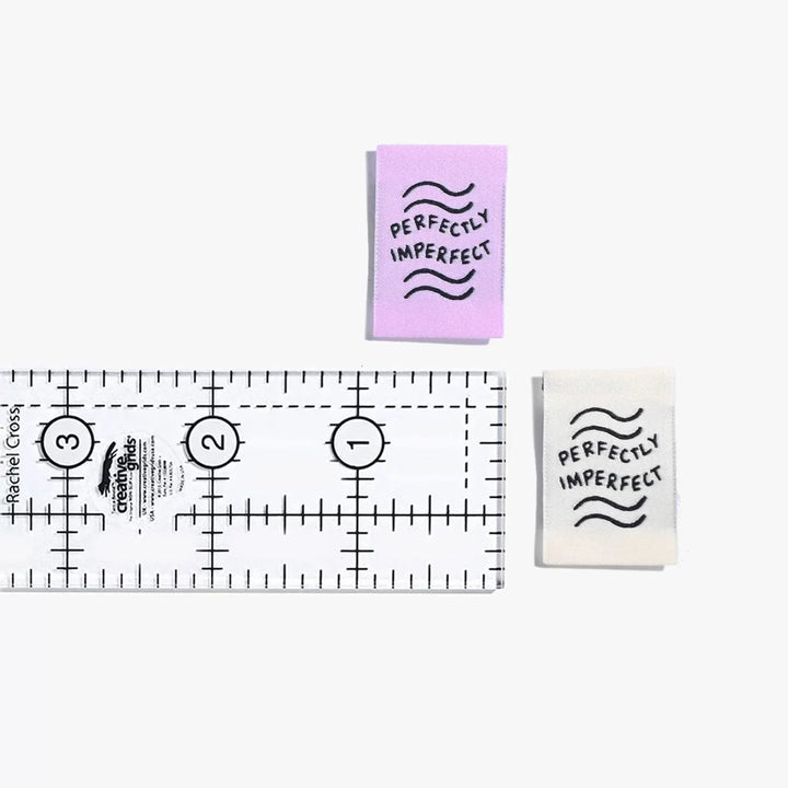 New 'Perfectly Imperfect' woven labels by Kylie and the Machine in lilac and ivory vaporwave colors - vertical end fold tags celebrating handmade beauty