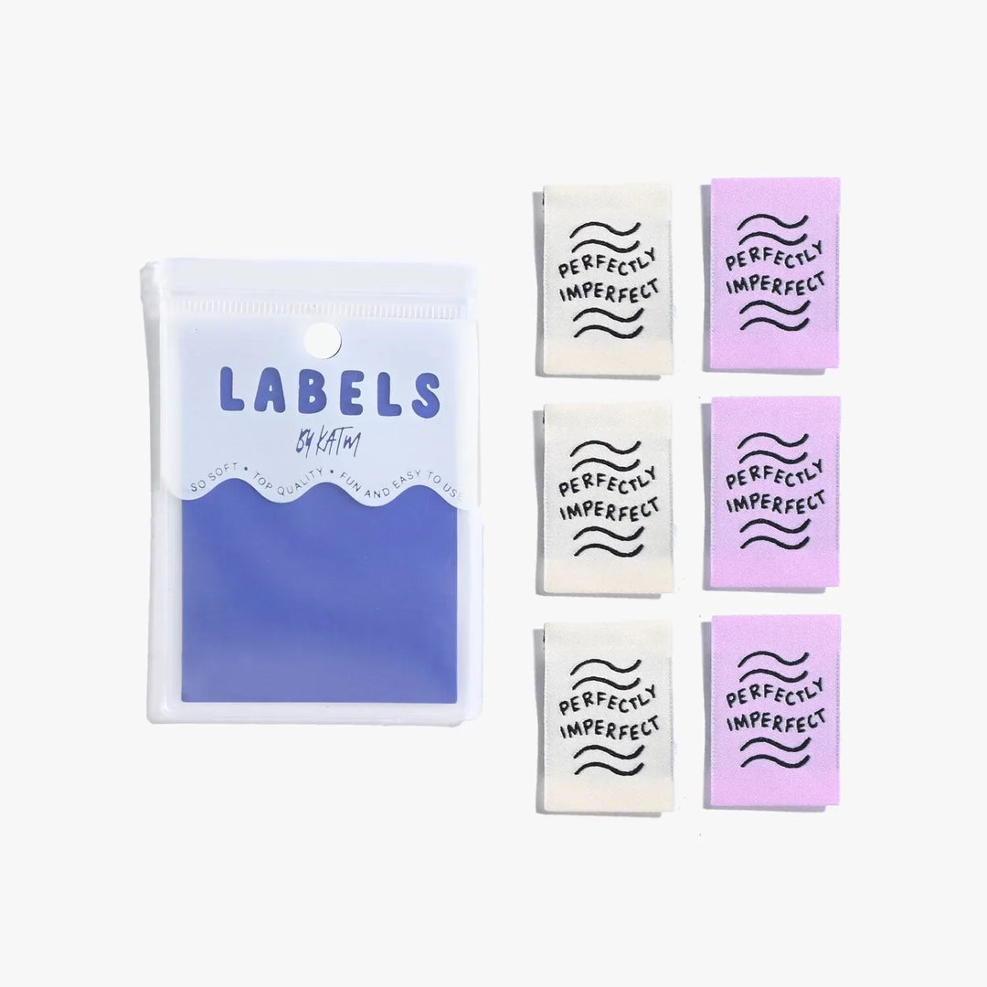 New 'Perfectly Imperfect' woven labels by Kylie and the Machine in lilac and ivory vaporwave colors - vertical end fold tags celebrating handmade beauty