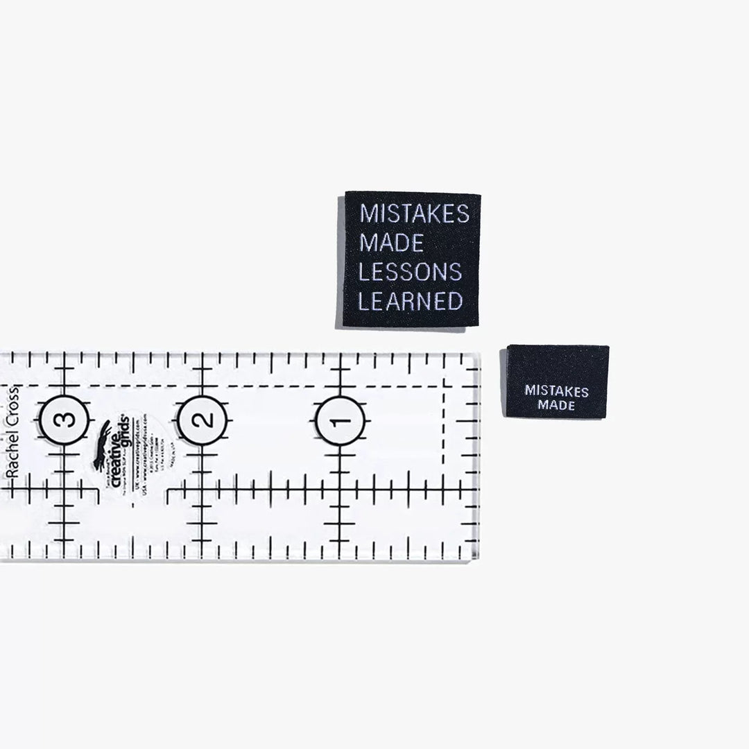 Motivational woven labels reading 'Mistakes Made Lessons Learned' in side seam and end fold styles by Kylie and the Machine - for proud skill-building sewists