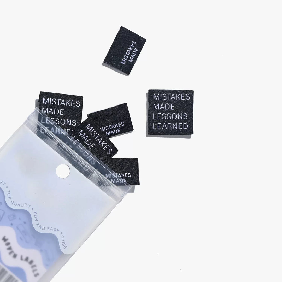 Motivational woven labels reading 'Mistakes Made Lessons Learned' in side seam and end fold styles by Kylie and the Machine - for proud skill-building sewists