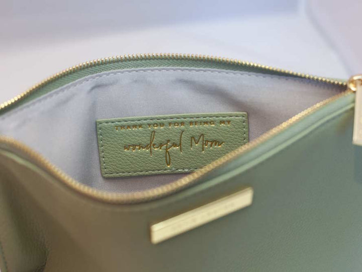 Katie Loxton Message Clutch in elegant design with zipper closure, available in multiple colors.