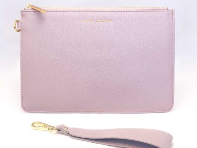 Everyday wristlet clutch in neutral color with removable strap and minimalist design.