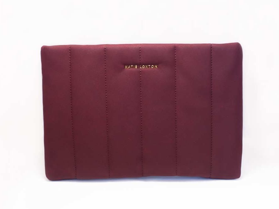 Kendra Quilted Clutch by Katie Loxton in soft vegan leather with quilted stripe pattern and gold-tone hardware.
