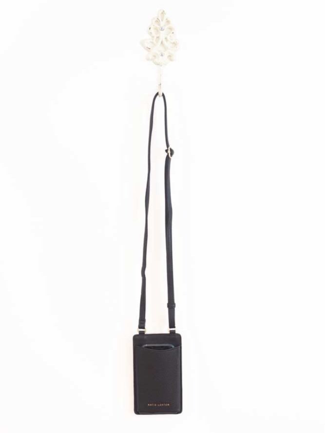 Classic crossbody bag in neutral colors with compartments for phone and cards