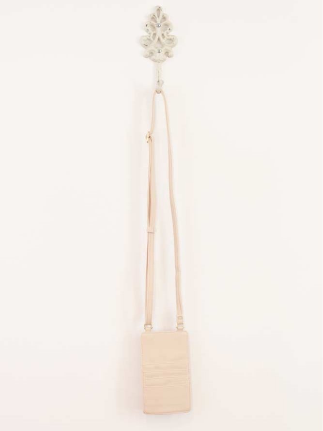 Classic crossbody bag in neutral colors with compartments for phone and cards