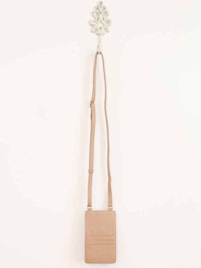 Classic crossbody bag in neutral colors with compartments for phone and cards