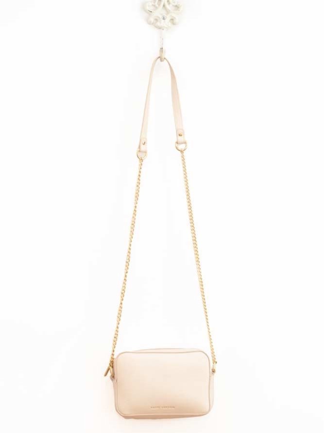 Millie Mini Crossbody handbag in vibrant green vegan leather with gold-tone hardware and delicate chain strap.