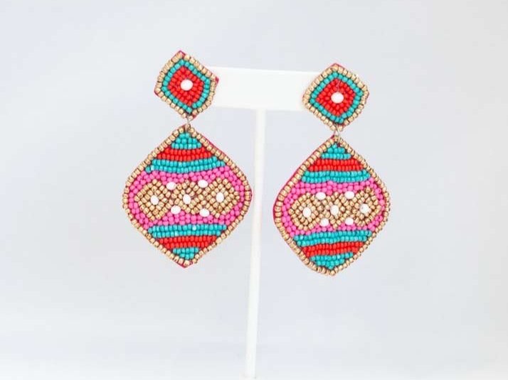 Vibrant Eclectic Beaded Earrings with playful designs like festive Christmas patterns, alcohol bottles, and bumblebees.
