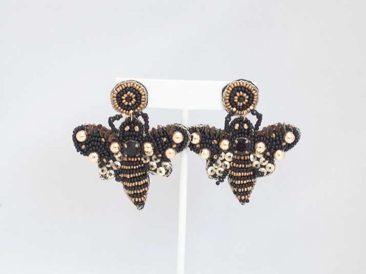 Vibrant Eclectic Beaded Earrings with playful designs like festive Christmas patterns, alcohol bottles, and bumblebees.