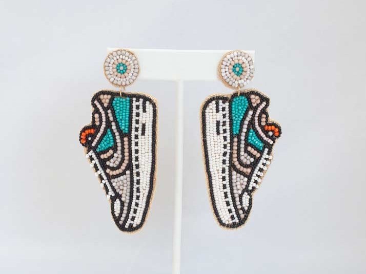 Vibrant Eclectic Beaded Earrings with playful designs like festive Christmas patterns, alcohol bottles, and bumblebees.