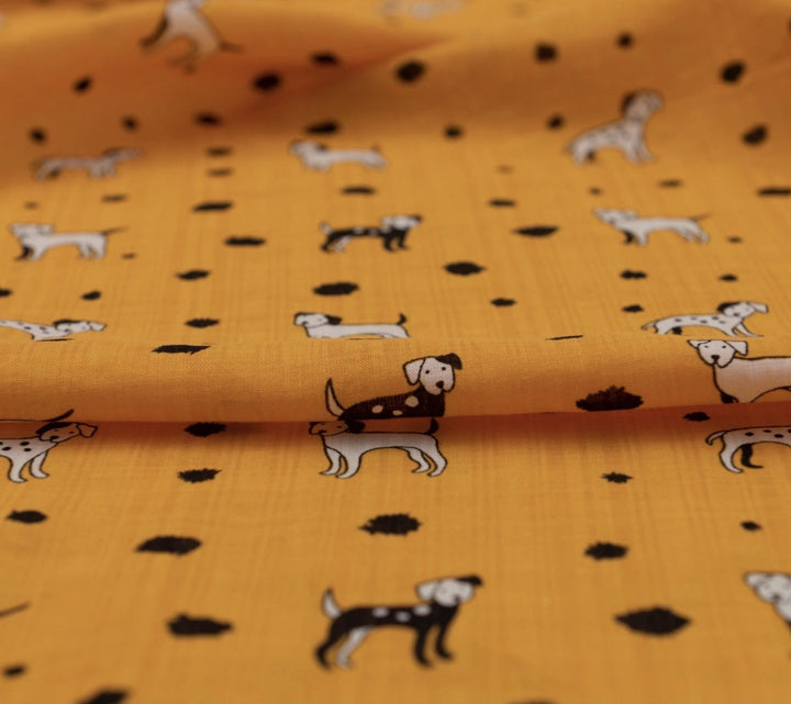 Rayon Cotton Voile fabric with playful black and white puppy print on sunshine yellow background, 50% rayon 50% cotton, 140cm width