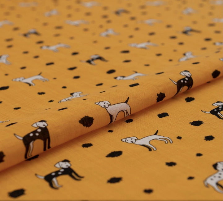 Rayon Cotton Voile fabric with playful black and white puppy print on sunshine yellow background, 50% rayon 50% cotton, 140cm width